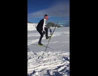 kid green skis moves legs flips