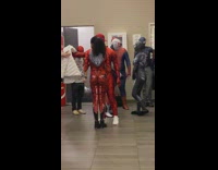 People wait for Spiderman movie in costumes 