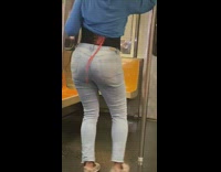 Girl dances shakes butt metal pole train