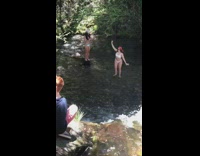 Woman white bikini red bandanna waterfalls