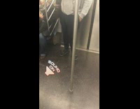 Person with black satchel bag singing loudly on subway