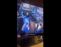 Woman films dance video drinks falls from tray