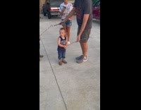 Little boy runs around with firework sparkler 