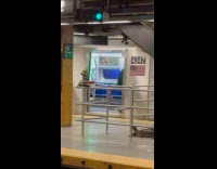 Men on platform and train dance to band