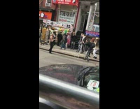 Girl in black outfit music video in busy street