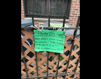 Green paper has message from angry neighbor about recycling dog poop 