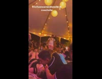 Woman vlogs inside the Coachella tent