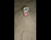 Multiple guys with head sticking out sand