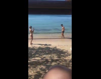 Man kneel sit pose on sand beach