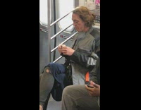 Woman gives herself shot of heroin need on subway train