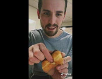 Guy opens donut 