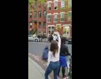 Guy sing girl white shirt dance street