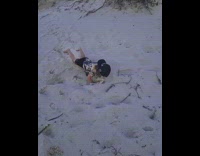 Kid falls and does scorpion on sand 