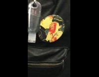 backpack button with man licking eye