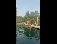 Man rides bicycle and jump on ramp to the ocean