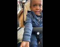 Toddler girl laughs at another toddler crying 