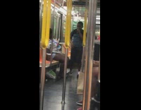 Blue shirt kid sings karaoke microphone subway 