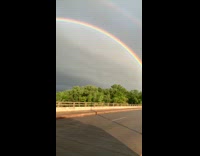 Double rainbow arch end bank bridge rain