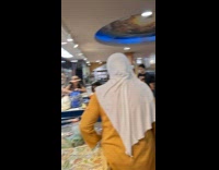 Old man sing at grocery store cashier