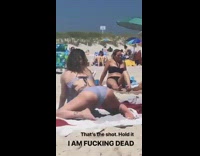 Woman grey bikini butt shot beach tattoo