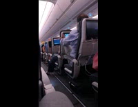 Collab VIBES - Man pushes airplane seat in his front