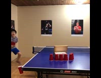 Boy does table tennis trick shot 