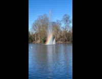 Rainbow reflection on fountain at London Park