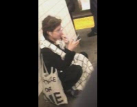 Woman squats on the ground, picks nose and eats boogers in subway station