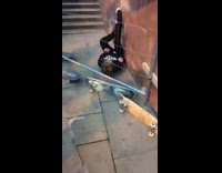 Kid jumps off stairs on skateboard and crashes into gate