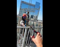 Woman ask window cleaner his favorite football team