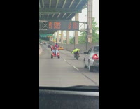 Two people ATV tricks at the highway