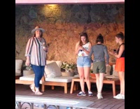 girl striped shirt points woman reacts