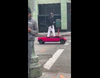 Man rides mini cybertruck strolls on street