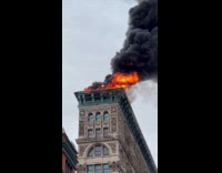 Fire and smoke on top of building