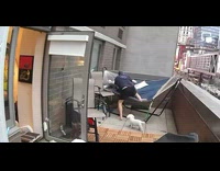 Security cam of guy who falls over while trying to lie on hammock