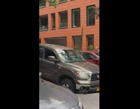 Truck trapped in hole in street