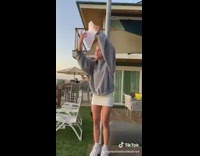 Girl on beach house asking guy in green shorts HOCO