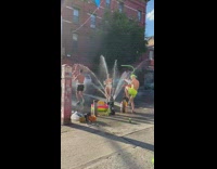 People dance with open hydrant 