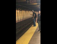 Guy plays with yoyo aggressively at the edge of subway platform