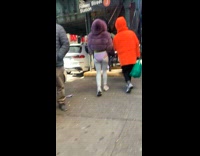 Girl wears purple underwear over grey leggings 