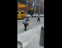 Girl wearing denim jacket poses in road