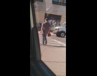 Man carry tool box walks across street in NY 