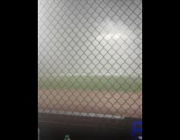 Rain storm at Citi Field Stadium net fence