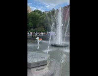 Human statue street performer pumpkin water fountain 