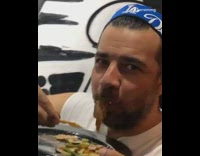 Man eat taco toppings fall plate graffiti wall