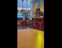 Man and woman reviews food inside the restaurant
