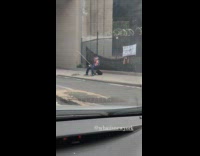 Collab WINY - Man Reads Book on Street as he Fish
