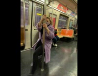 Woman dances on train 