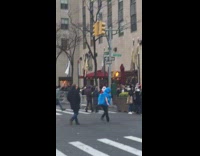 blue man dressed as driedel in street