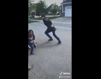 Guy plays basketball with neighborhood kids 